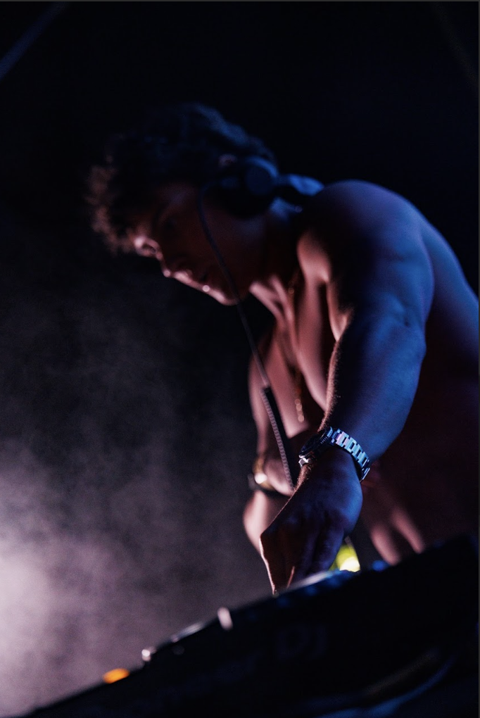 T-MØTION mixing at the DJ booth