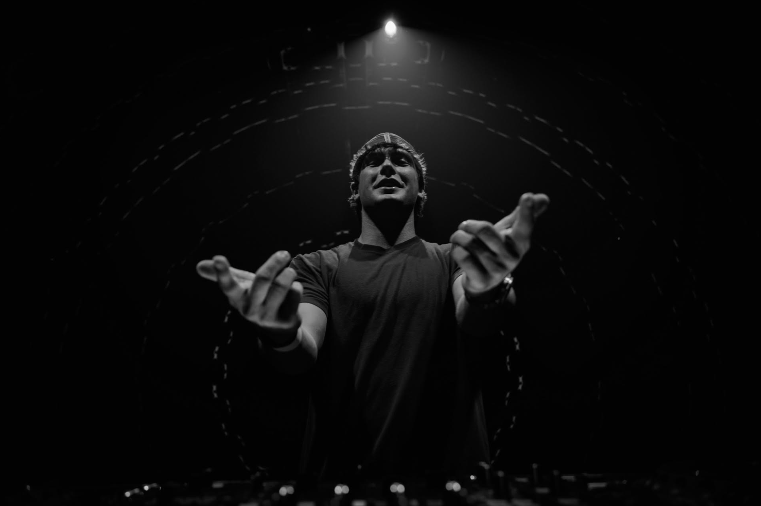 Black and white photo of T-MØTION DJing